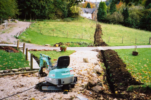 Digging a narrow channel for cables and pipes